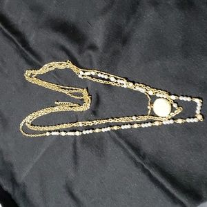 Lia Sophia goldtone triple strand necklace with pendant and stones.